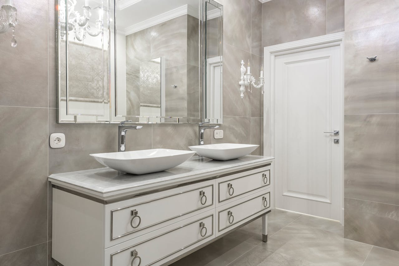 Sophisticated bathroom design featuring dual sinks, luxury decor, and modern elegance.